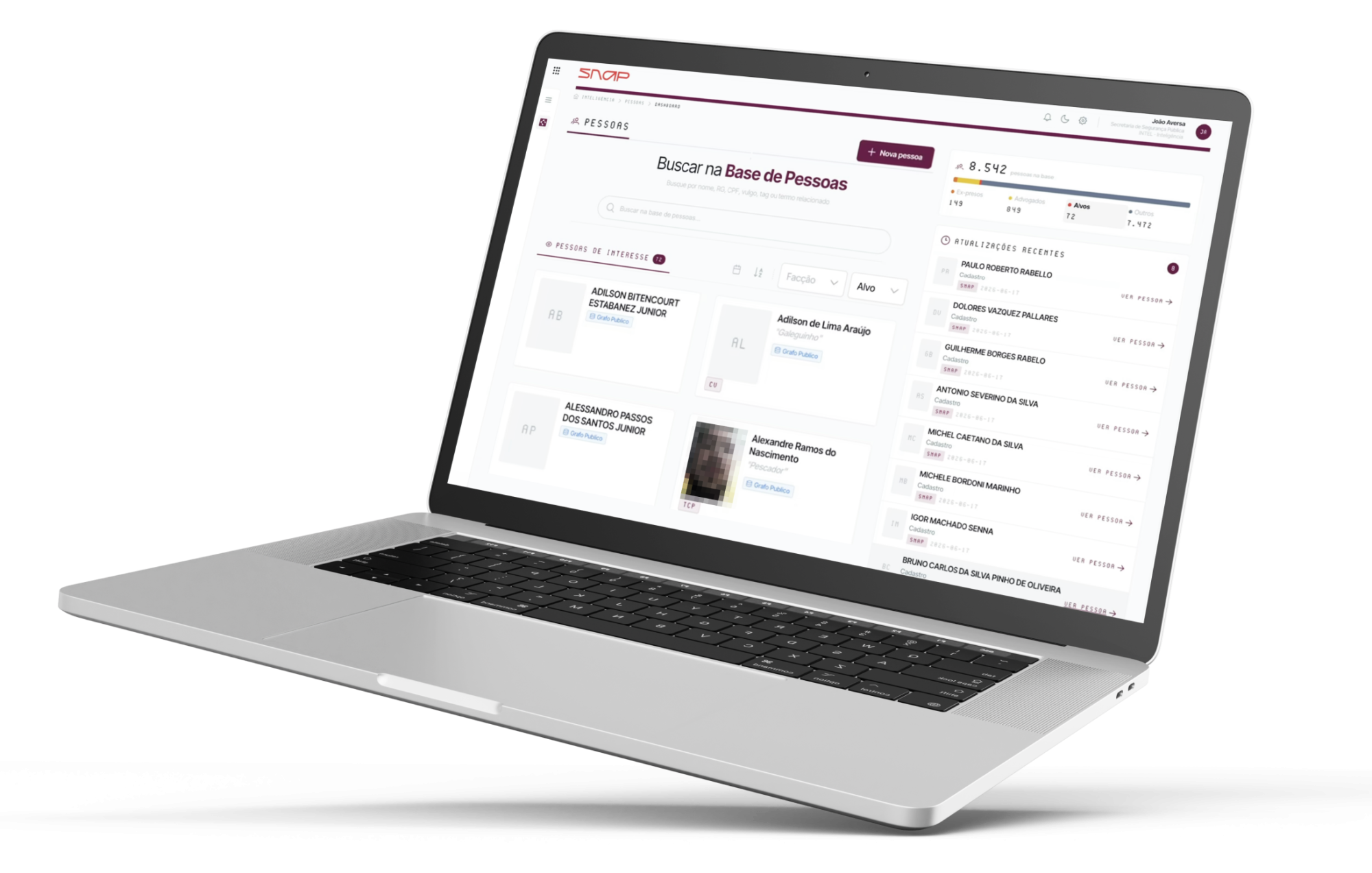 Laptop screen displaying a dashboard for searching a people database, with a search bar and list of contact cards.